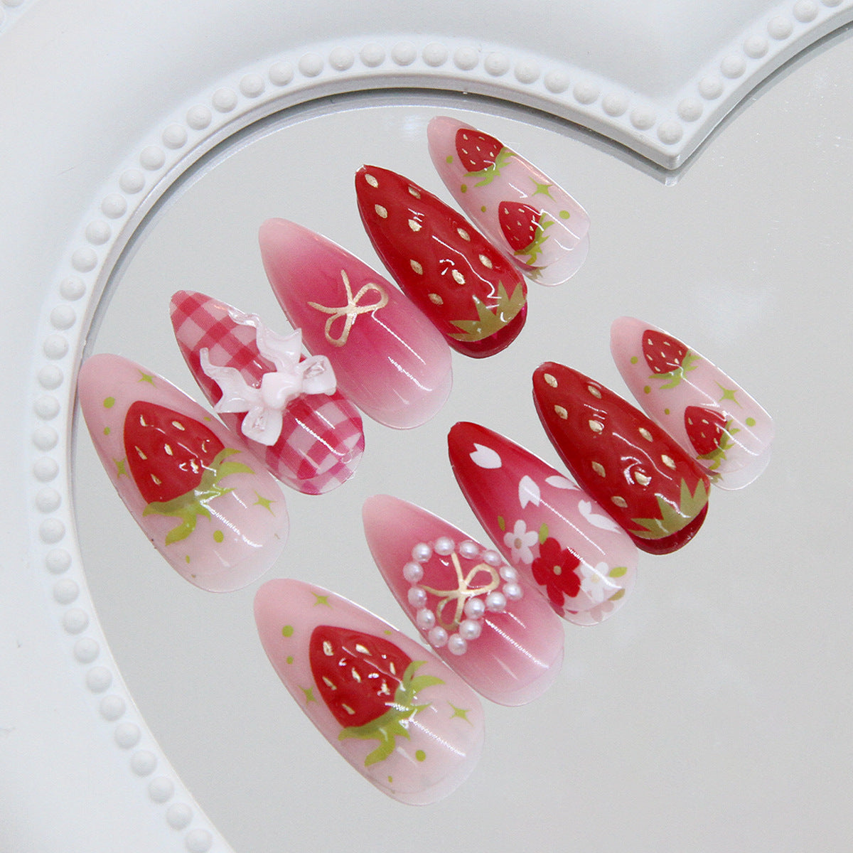 Strawberry & Pearl Detail Almond Nails, Medium Almond, 24 Pieces – side angle