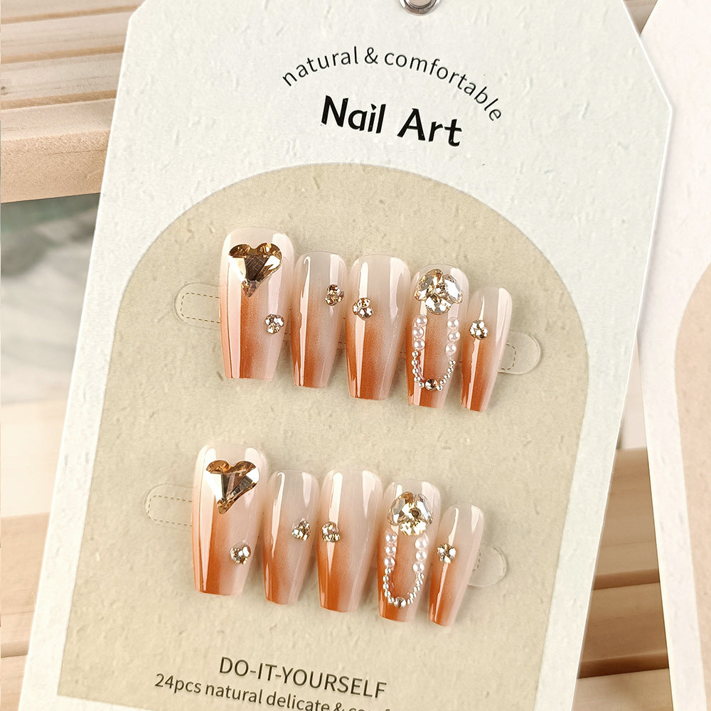 Pearl Detail & Heart Press-On Nail Set (24 Pieces) on hand