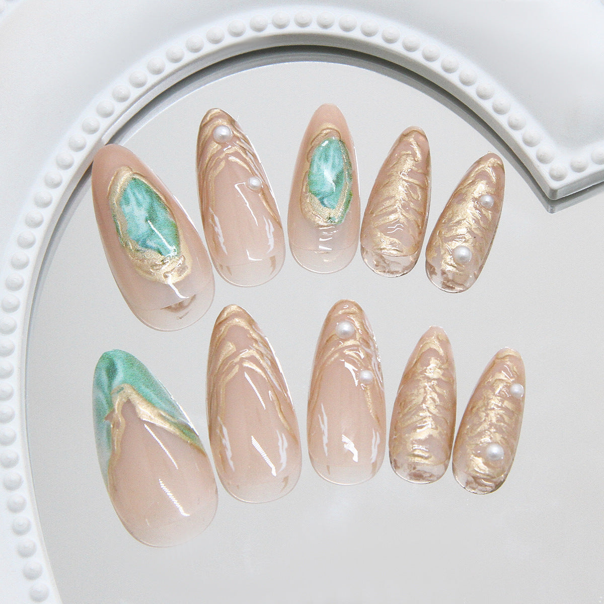 Gilt French Tip Press-On Nails with Aurora Quicksand & Pearls, Almond on hand