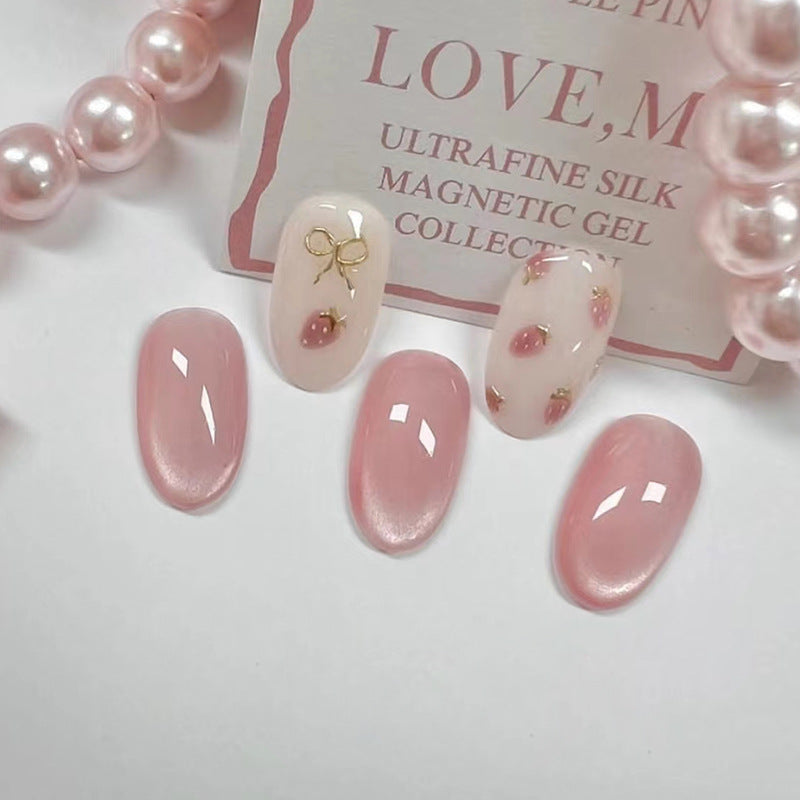 Cat Eye & Bowknot Press-On Nails, Medium Oval on hand